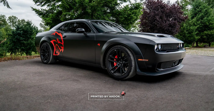 Dodge Challenger SRT Hellcat wrapped in satin black with a red Hellcat graphic by Ardor Printing near Seattle