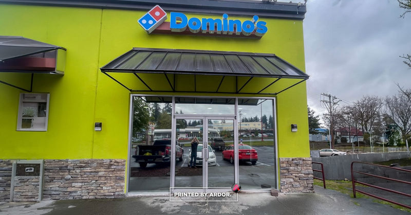 Domino's storefront windows after frosted privacy film install by Ardor Printing