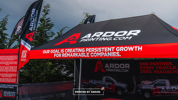 Ardor Printing branded event tent with feather flags