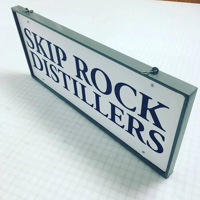 Fabricated hanging metal sign we made for Skip Rock Distillers in Snohomish, WA