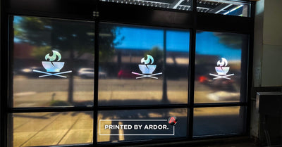 Frosted vinyl logo window decals on restaurant glass by Ardor Printing