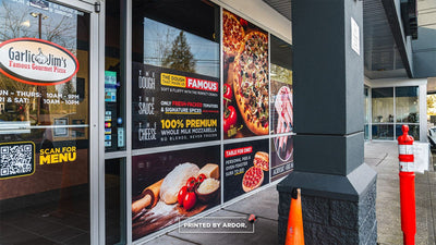 Garlic Jim's pizza storefront with full-color perforated window graphics by Ardor Printing