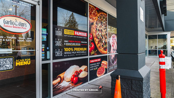 Garlic Jim's pizza storefront with full-color perforated window graphics by Ardor Printing