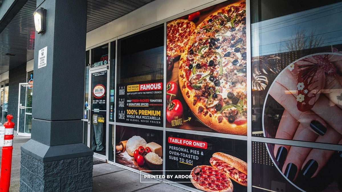 Garlic Jim's pizza storefront with full-color perforated window graphics installed by Ardor Printing