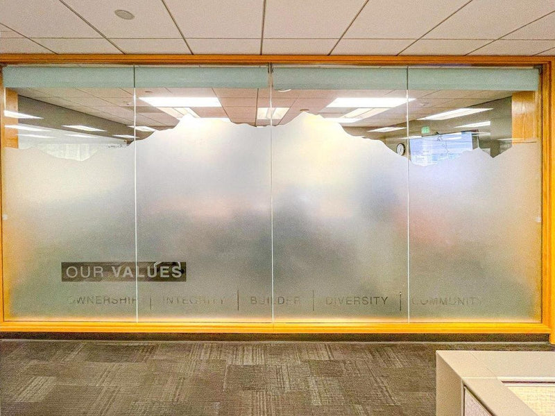 Custom-cut frosted window film with mountain skyline design on Hensel Phelps office conference room glass by Ardor Printing