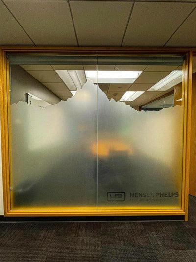 Custom-cut frosted window film with mountain skyline design on Hensel Phelps office conference room glass, view 2 by Ardor Printing