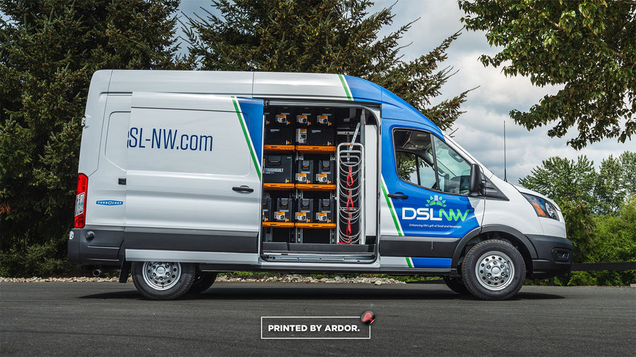 High-roof Ford Transit with tool storage upfit and fleet graphics