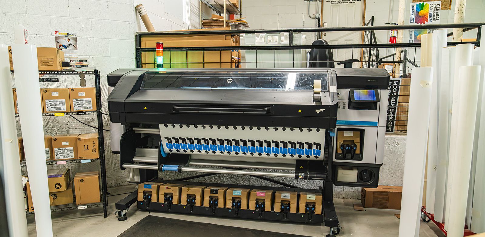 HP Latex wide-format printer printing a run of decals inside the Ardor Printing production shop