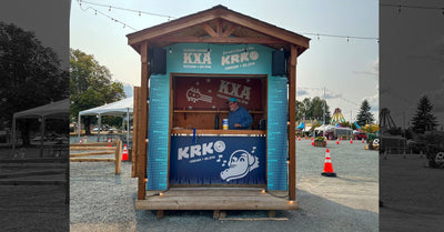 KRKO and KXA radio station event booth covered in custom printed graphics by Ardor Printing