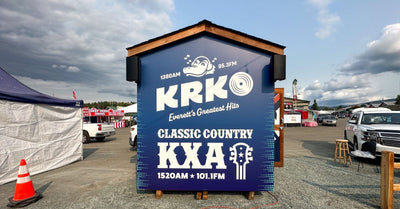 KRKO and KXA radio station event booth covered in custom printed graphics by Ardor Printing, view 3