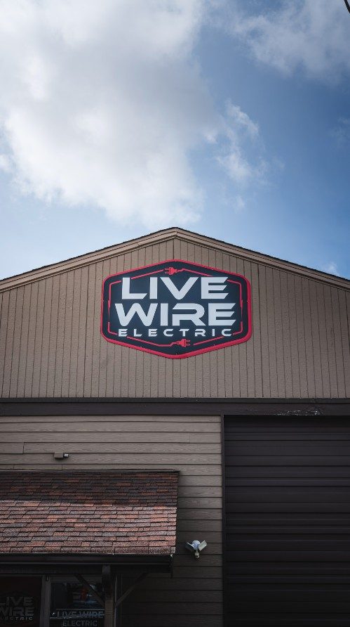 Live Wire Electric building sign installation by Ardor Printing