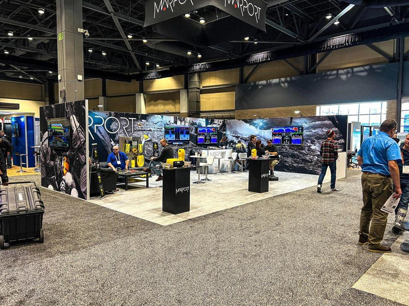 Marport island trade show booth with printed wall graphics and hanging sign by Ardor Printing, view 13