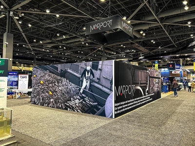 Marport island trade show booth with printed wall graphics and hanging sign by Ardor Printing, view 7