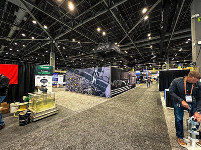 Marport island trade show booth with printed wall graphics and hanging sign by Ardor Printing, view 9