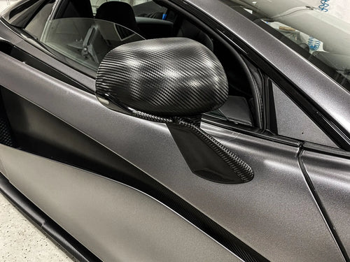 Close-up of carbon fiber wrapped mirror caps on a satin grey wrapped McLaren 570S, Ardor Printing