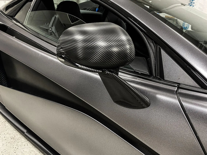 Close-up of carbon fiber wrapped mirror caps on a satin grey wrapped McLaren 570S, Ardor Printing