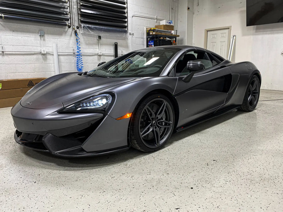 McLaren 570S with a full satin grey color change wrap in the Ardor Printing install bay near Seattle, WA