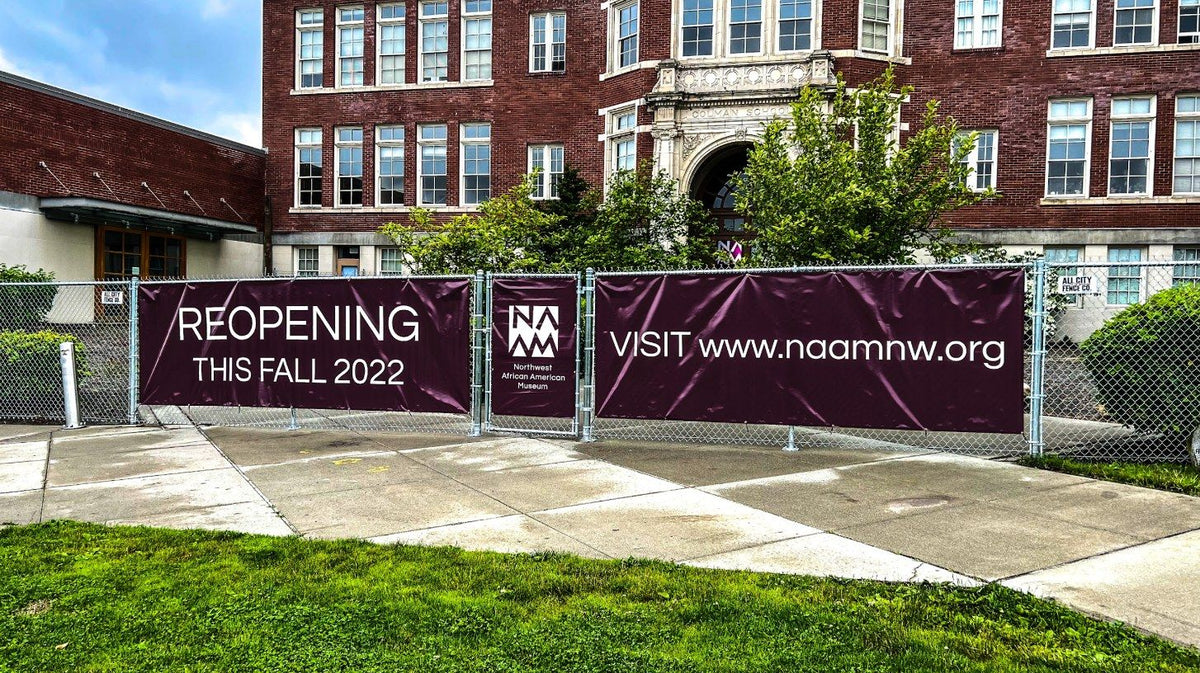 Reopening banners on the construction fence at the Northwest African American Museum in Seattle