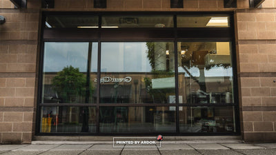 Nom House storefront windows before window graphics by Ardor Printing