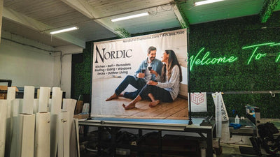 Nordic Home Solutions custom fabric backdrop banner on a stand by Ardor Printing, view 3