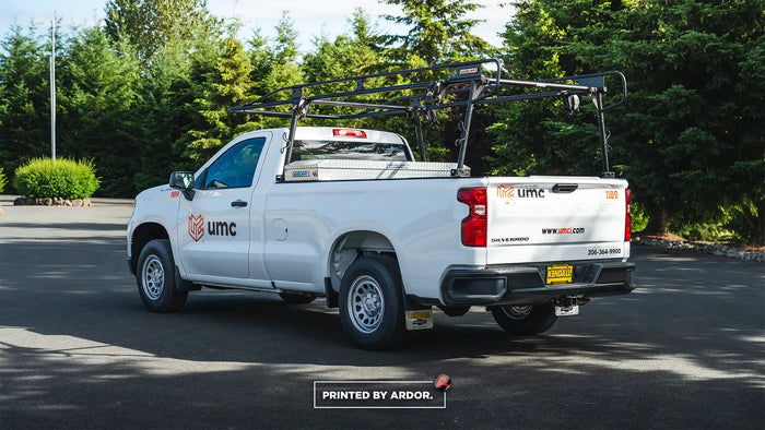 Work truck upfit with ladder rack and crossover toolbox for UMC