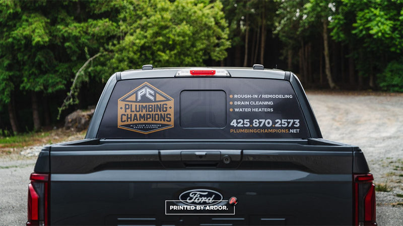Plumbing Champions one-way vision perforated film on a truck rear window by Ardor Printing