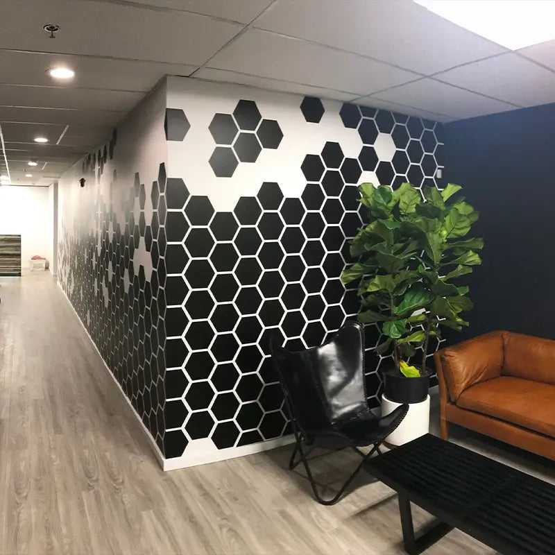 Large diecut wall vinyl wrap we installed for Heaton Dainard Real Estate at their Bellevue, WA office. These graphics were computer cut on matte black 3M vinyl.