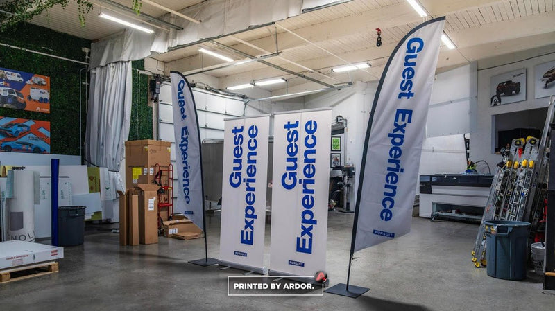 Pursuit Guest Experience feather flags and retractable banners by Ardor Printing