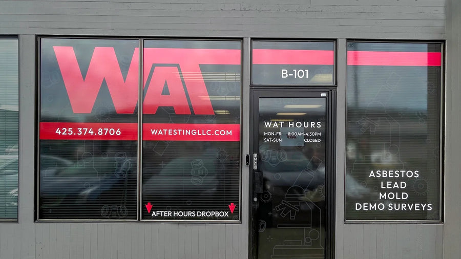 WAT logo storefront window graphics with phone number, website and office hours on the Washington Asbestos Testing office in Everett