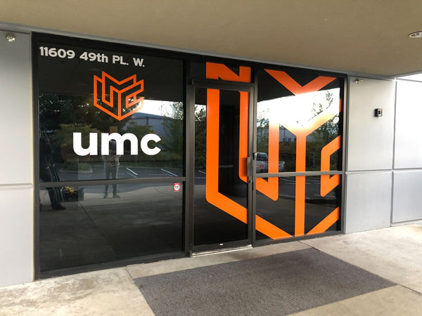 UMC building entrance with large cut vinyl logo window graphics by Ardor Printing