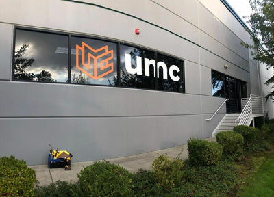 UMC building entrance with large cut vinyl logo window graphics, view 2 by Ardor Printing