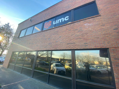 UMC building entrance with large cut vinyl logo window graphics, view 4 by Ardor Printing