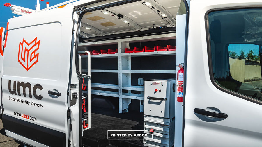 Upfitted service van with open side door showing shelving, Everett WA