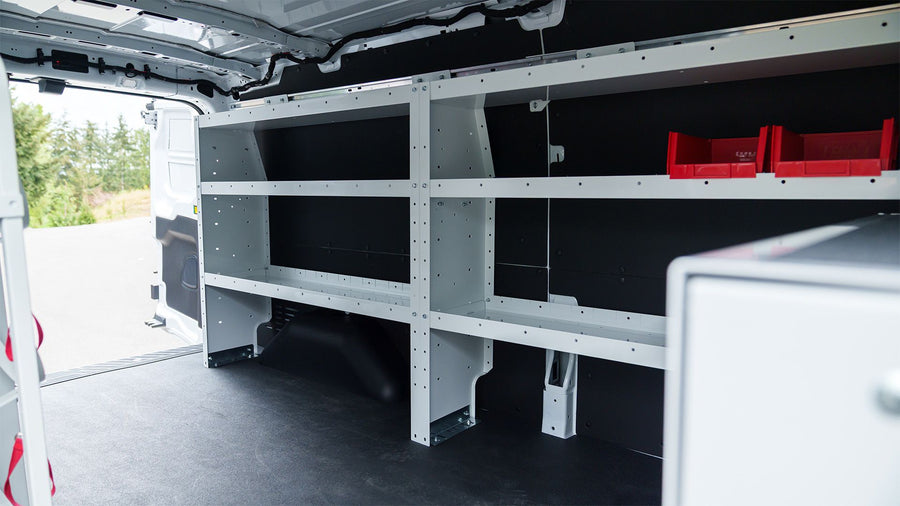 WEATHER GUARD steel shelving and red parts bins in a cargo van
