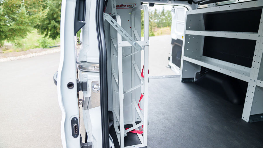 WEATHER GUARD shelving and ladder storage at the van side door