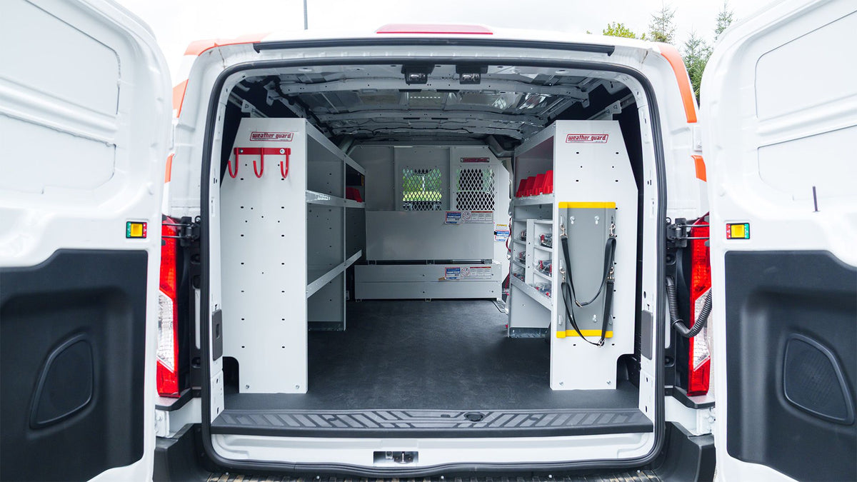 WEATHER GUARD steel van shelving and bins installed inside a Ford Transit cargo van