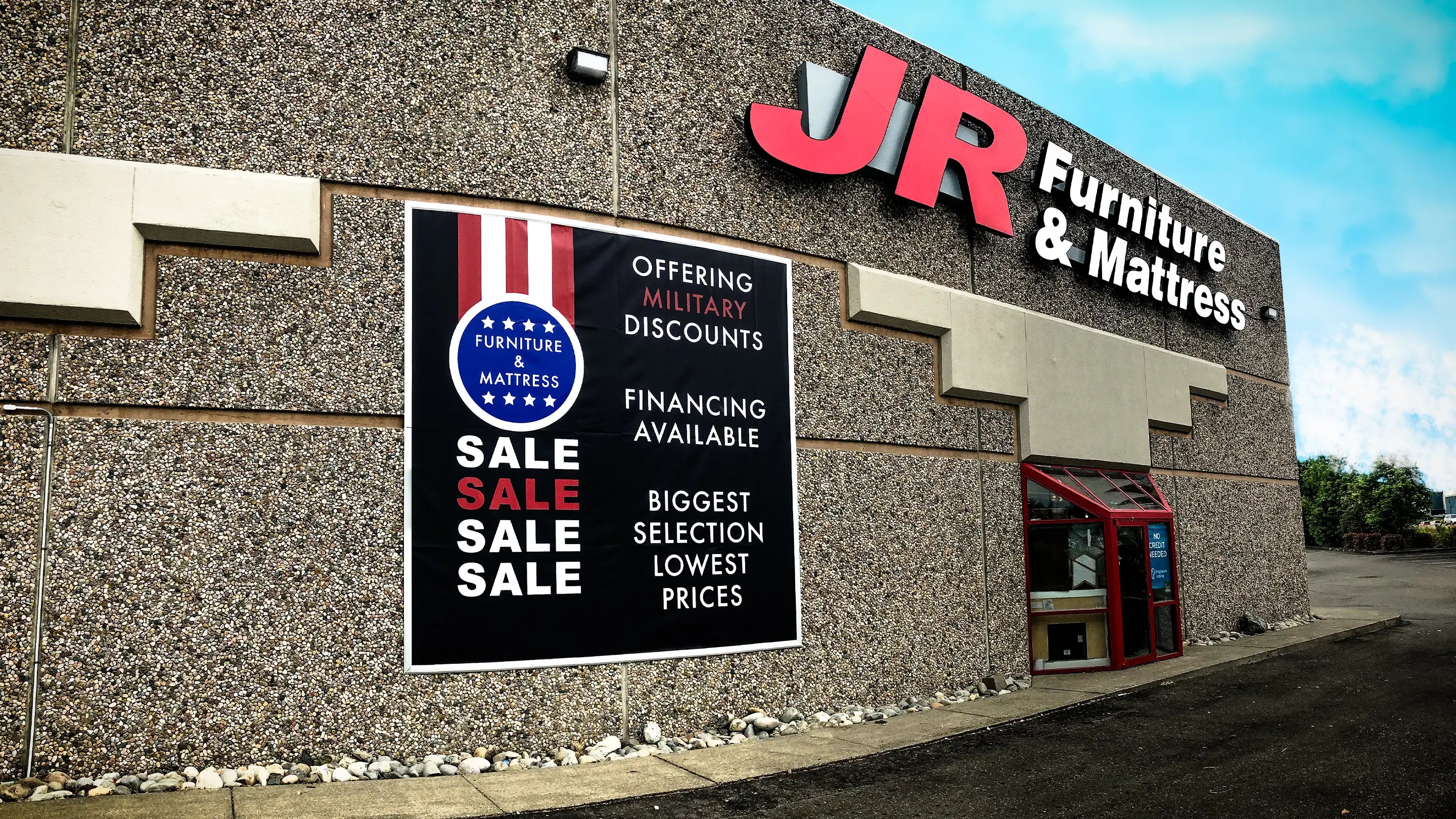 Large banner framing system we designed and made for JR Furniture in Lakewood, WA. These grand-format banners were designed and printed in-house and installed by our banner installation team.