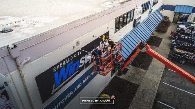 Winsupply rigid sign installation from a lift by Ardor Printing