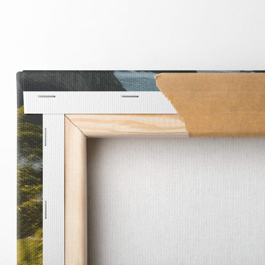 Detailed view of the folded corner of a canvas print featuring a black 1970 Dodge Charger RT driving along the Pacific Ocean.