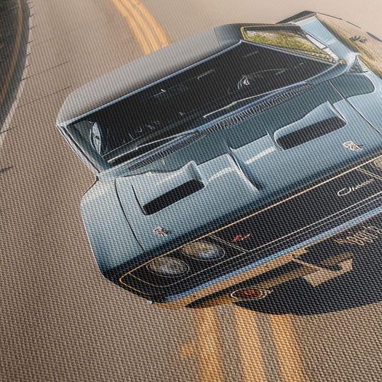 Close-up of the textured canvas material and high-quality detail on a canvas print of a black 1970 Dodge Charger RT driving.