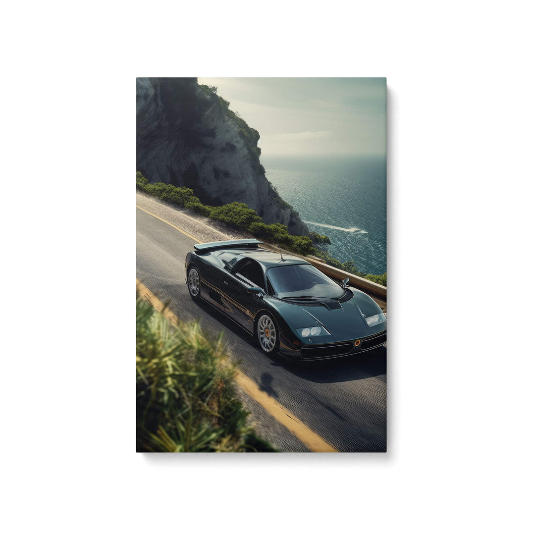 High-quality canvas print of a black Bugatti EB110 Super Sport cruising the shoreline with ocean-side cliffs in the background.