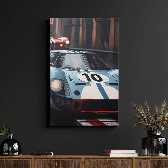 Bold canvas print on black wall above wood desk, featuring intense Ford vs Ferrari race scene with vibrant colors.