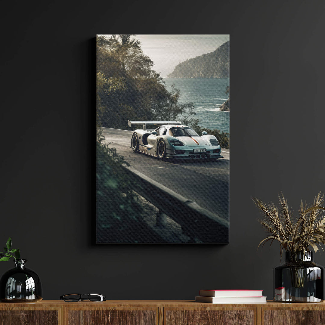 Stunning silver Porsche 911 GT1 Strassenversion canvas print on black wall above wood desk in living room.